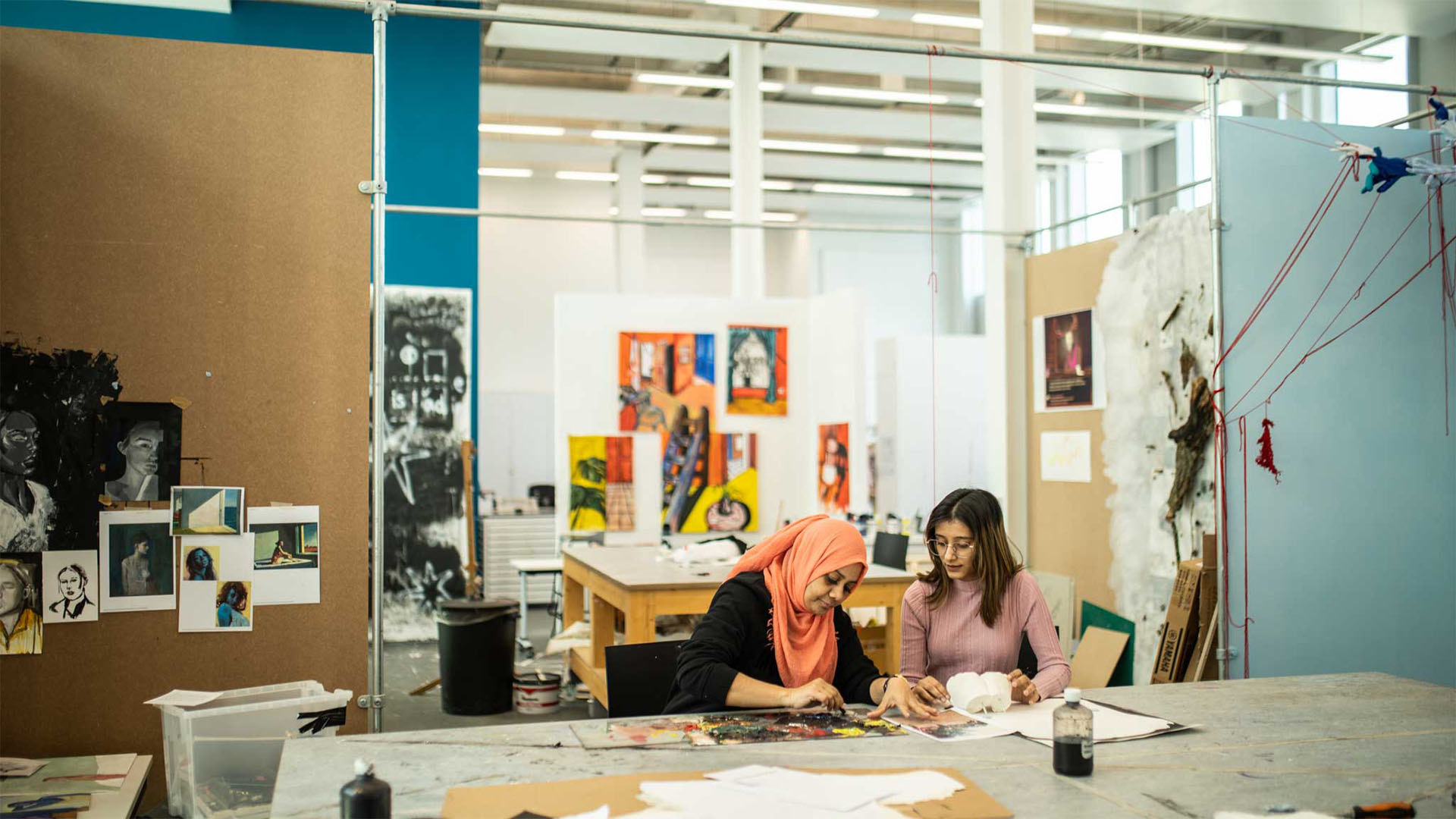 Two contemporary Fine Art students in workshop