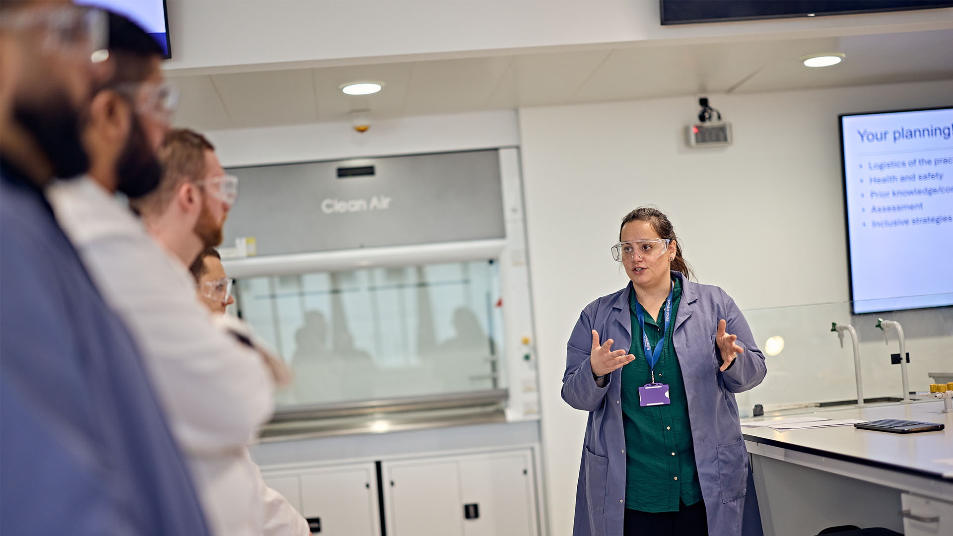 Science teacher speaking to her class