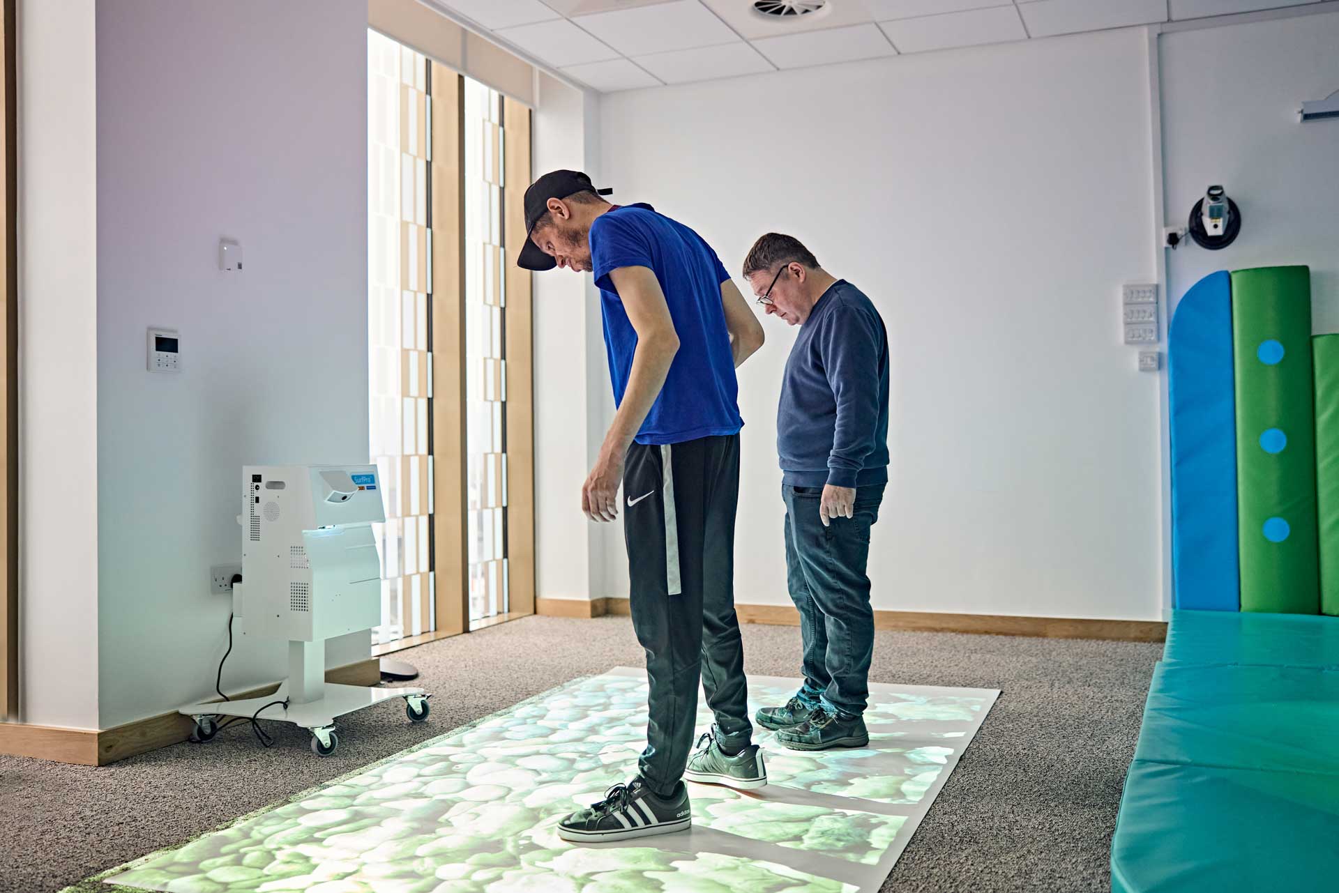 Service users exploring the interactive floor projection