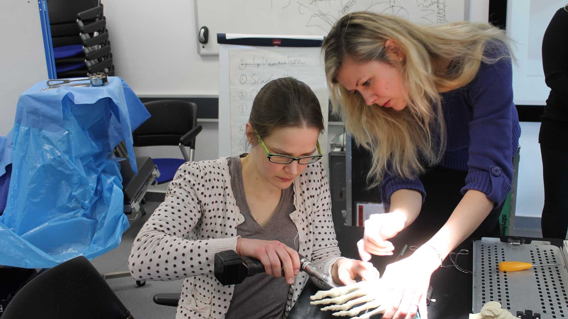Student practising foot surgery