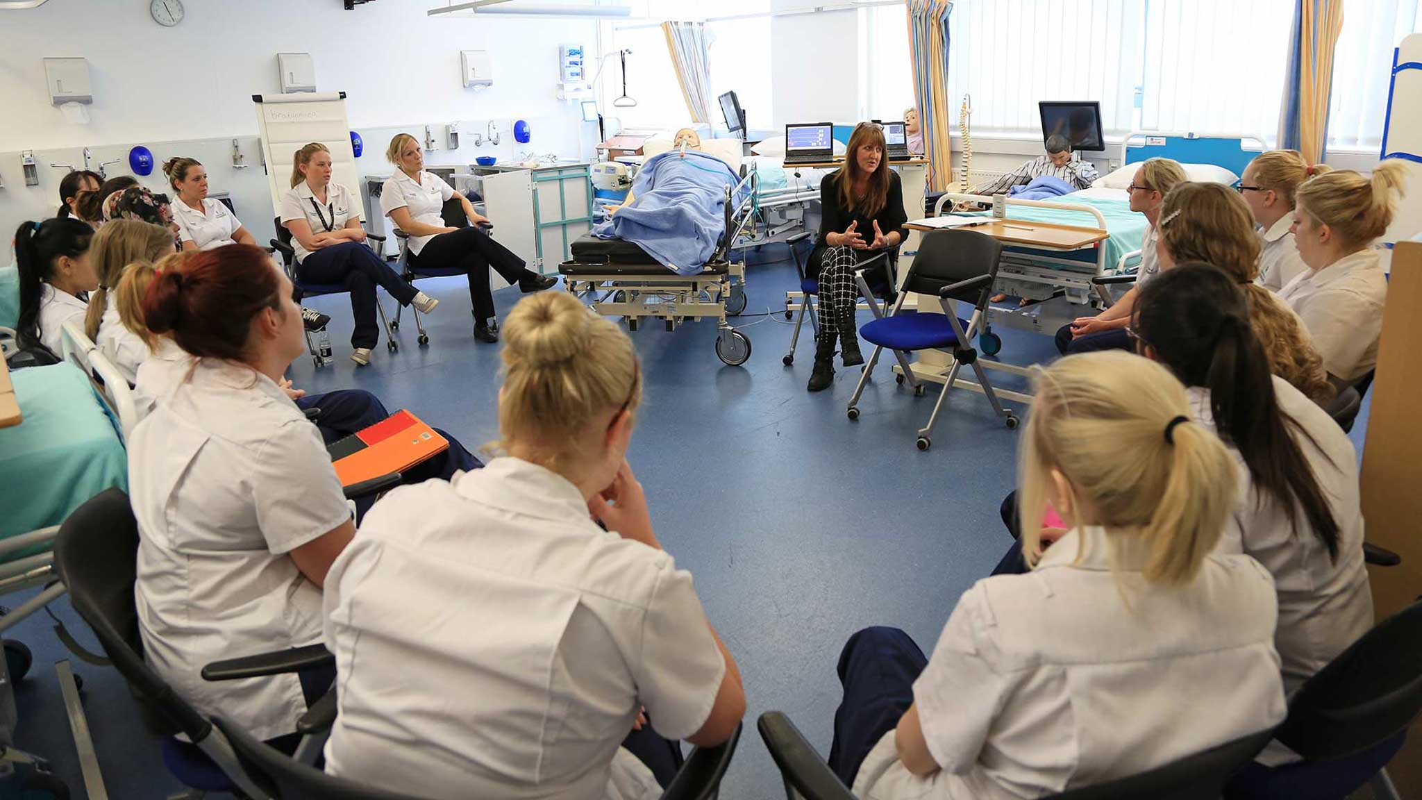 A group of students in class listening to their lecturer