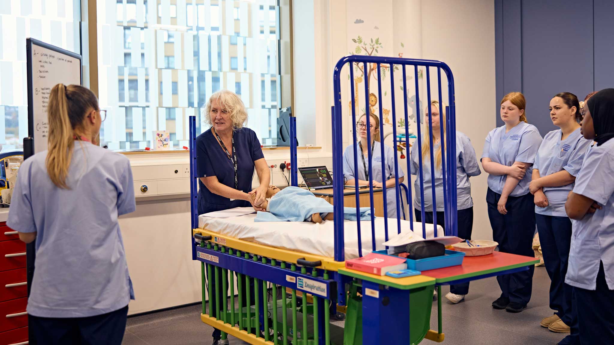 Students learning about their course in a simulated hospital setting