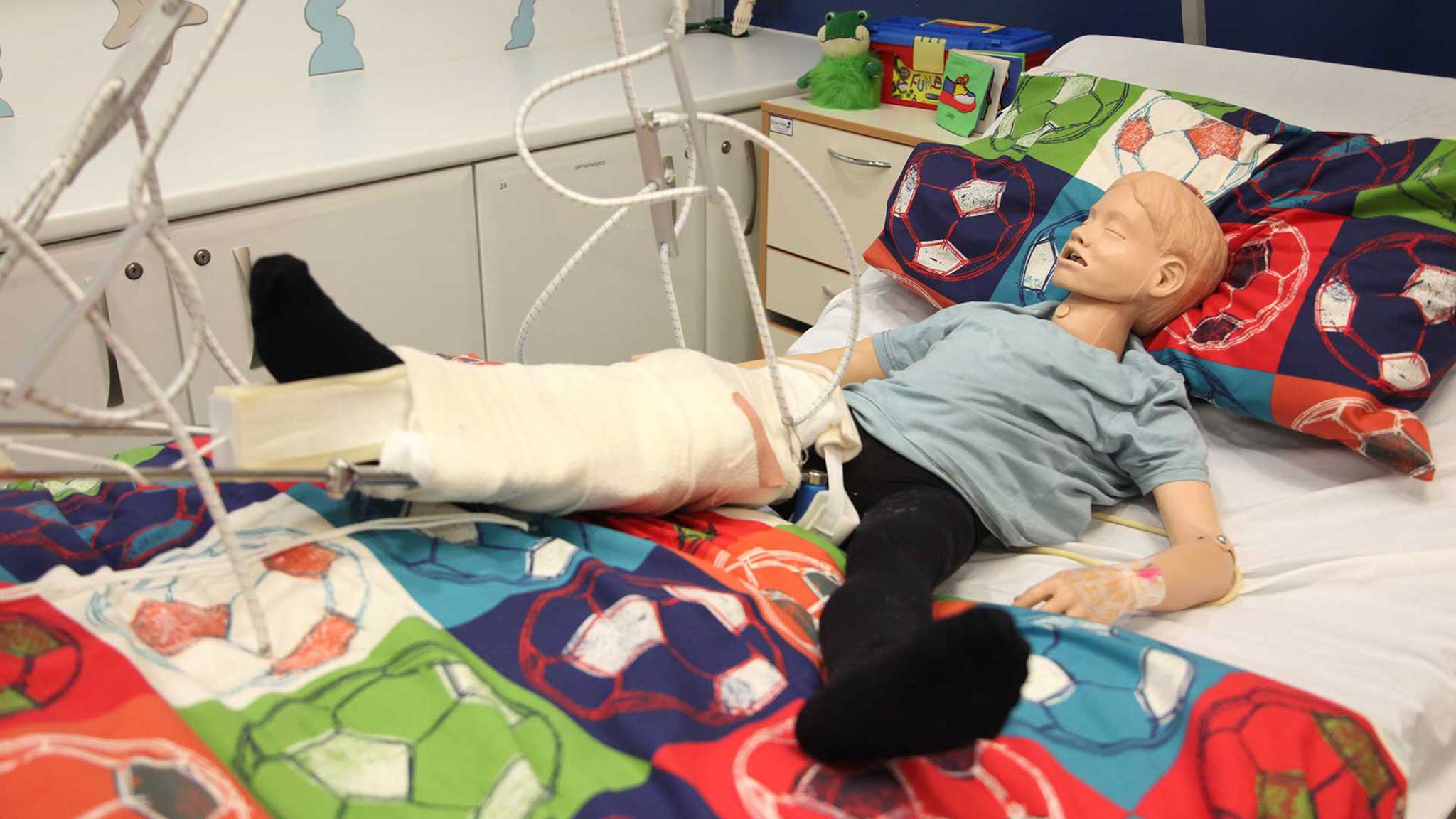 Sam a mannequin used to help you learn how to care for children on traction