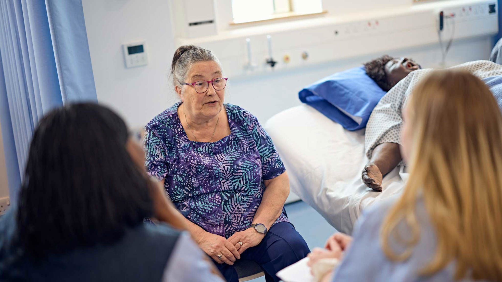 Students gathering a social history from a Service User