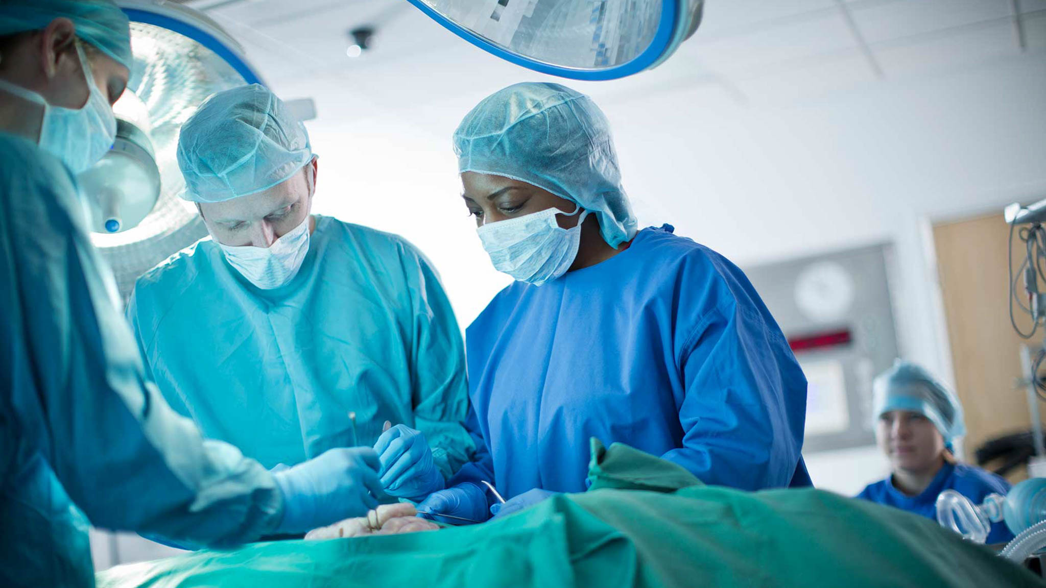 Students working as a team in simulated operating theatre