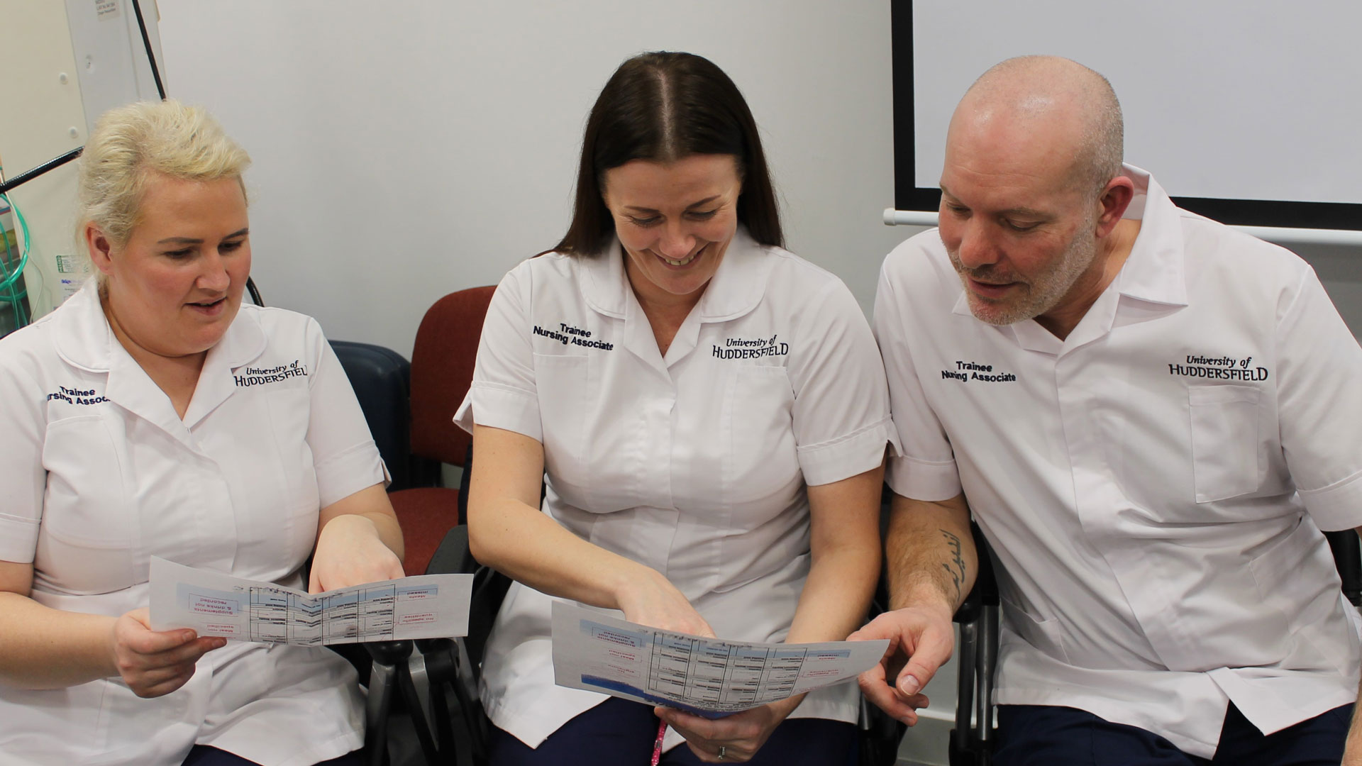 Nursing associates working together